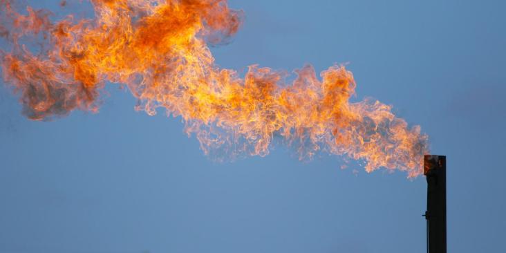 Methane flare atop a smokestack